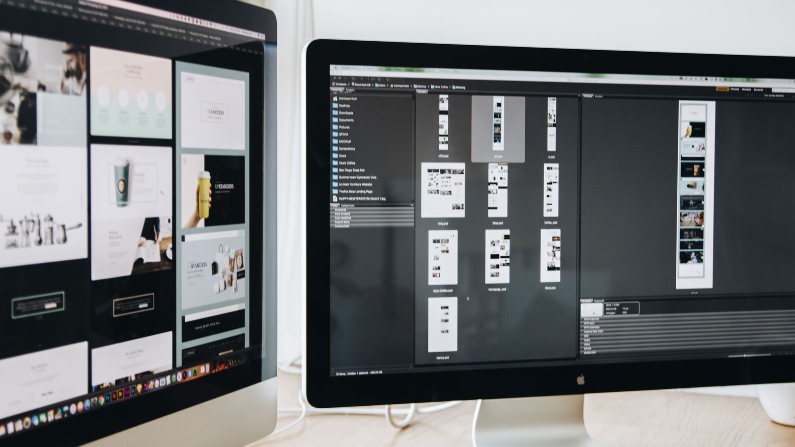 Two desktop monitors in a creative workspace.