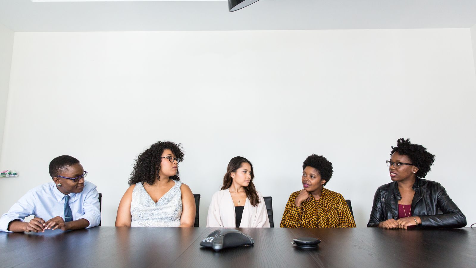 A diverse group collaborating in a business meeting.