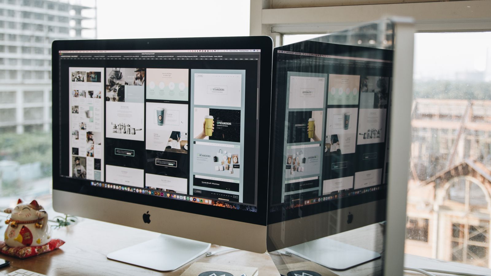 A design workspace with two computer monitors.